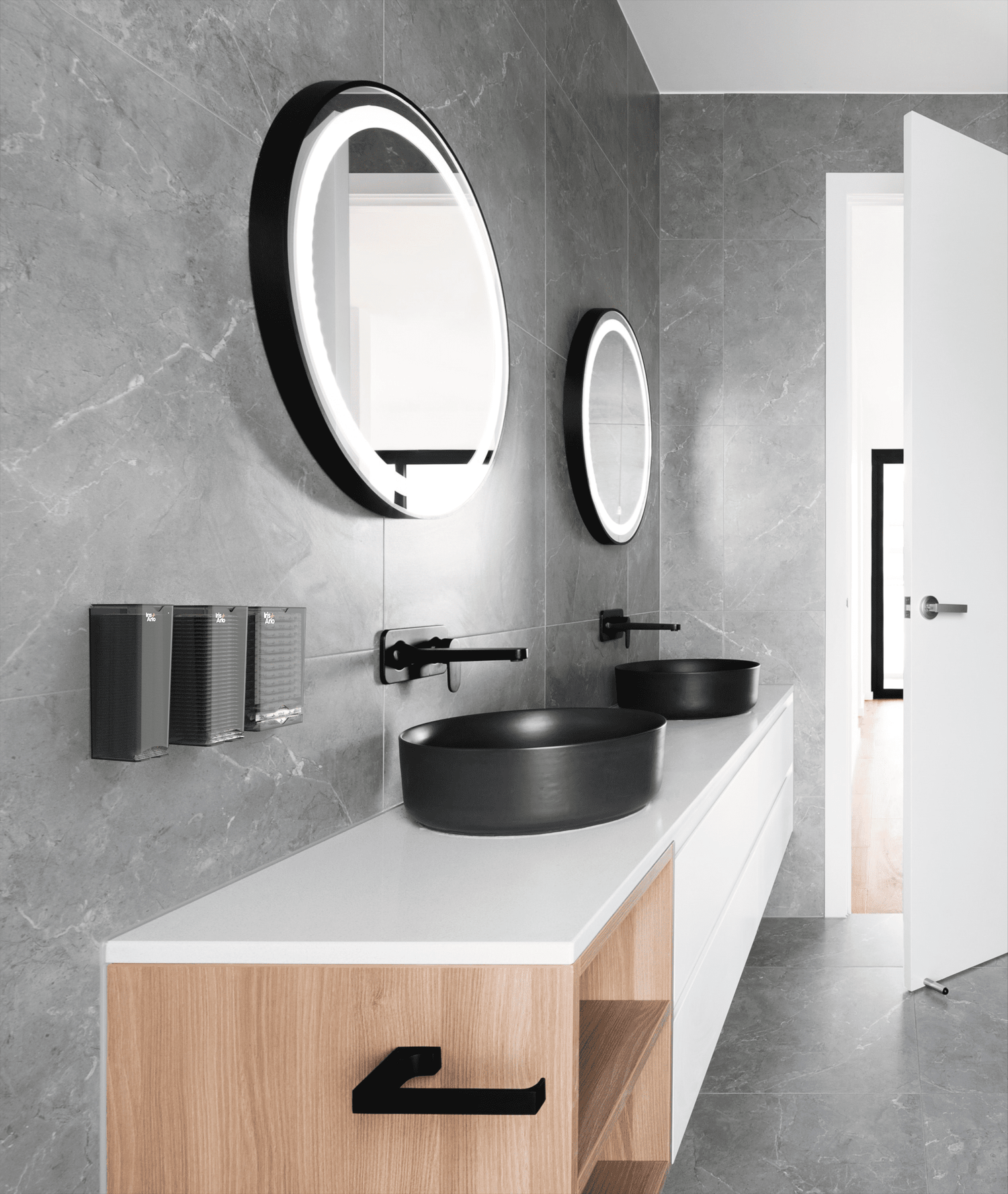 Iris + Arlo 3-Pack | Recycled Wall-mounted Plexiglass Dispensers in a corporate bathroom